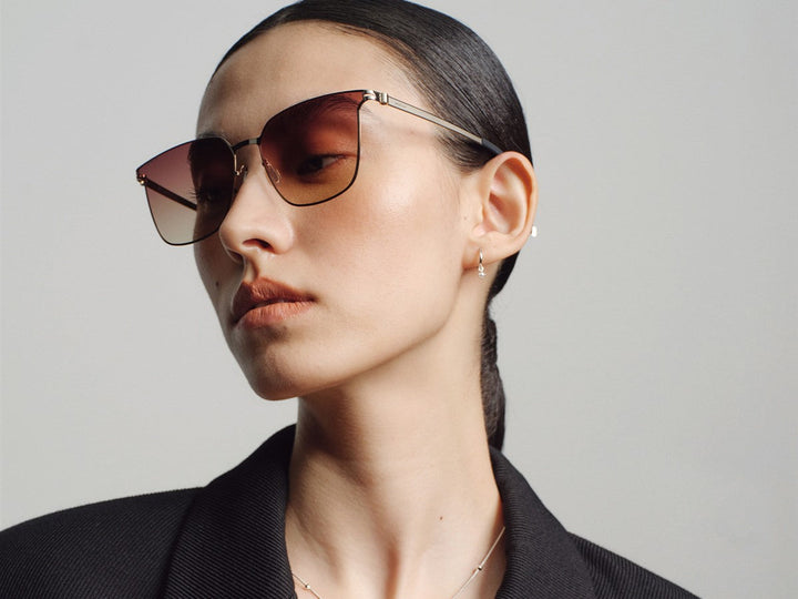 Model wearing MUJOSH low bridge fit sunglasses, the frame resting on the nose bridge with the lenses clear of the cheeks